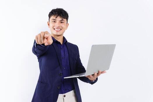 Smiling professional in a suit holding a laptop